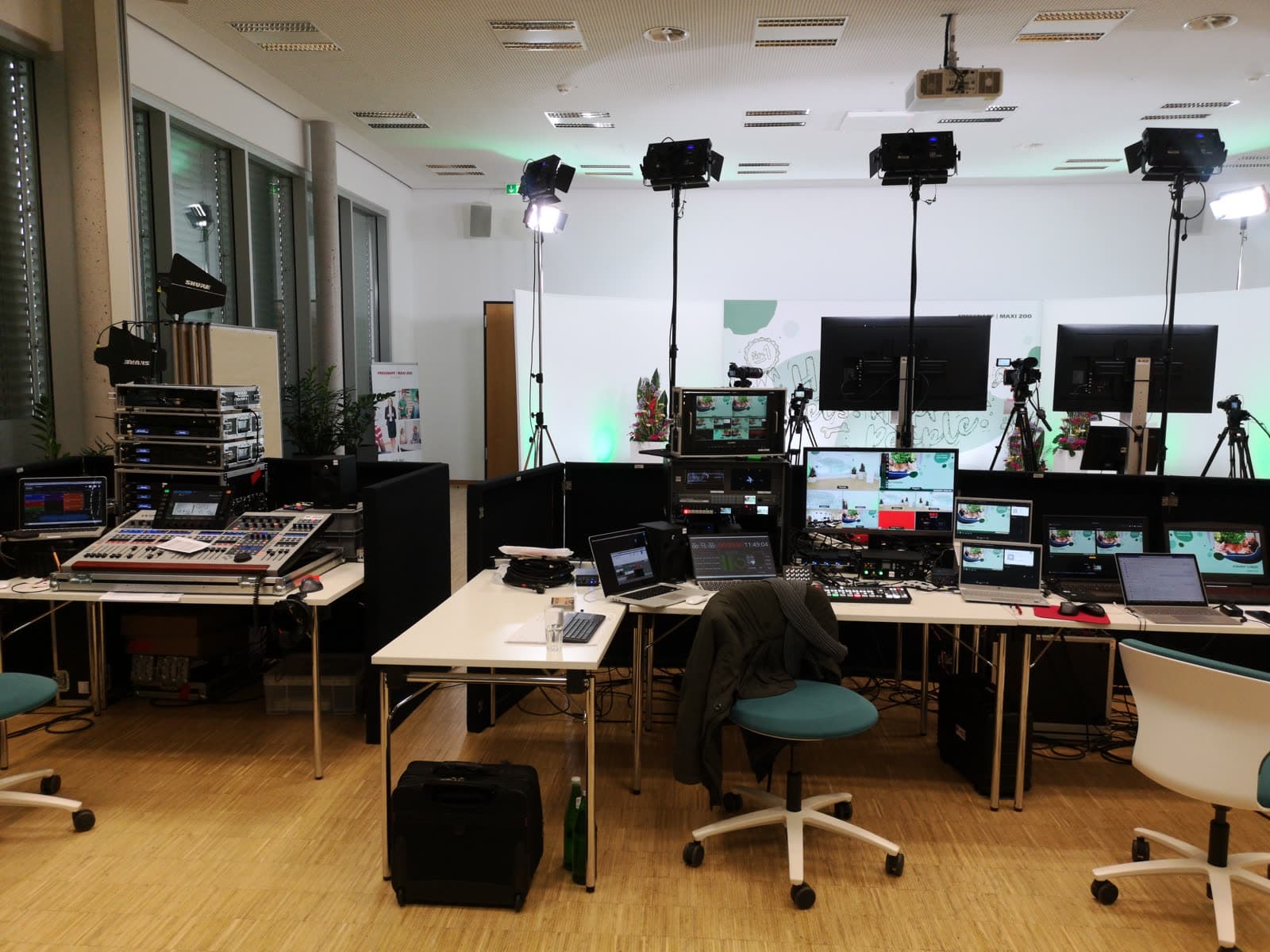 Broadcast control room with monitors and mixing desks
